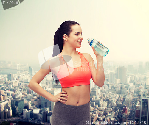Image of sporty woman with water bottle