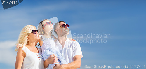 Image of happy family with blue sky