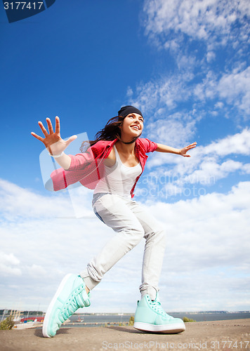 Image of beautiful dancing girl in movement