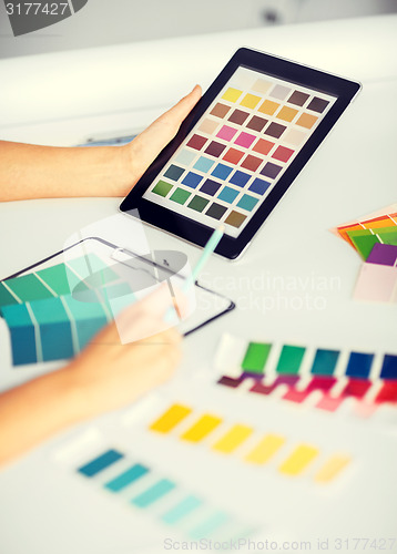 Image of woman working with color samples for selection