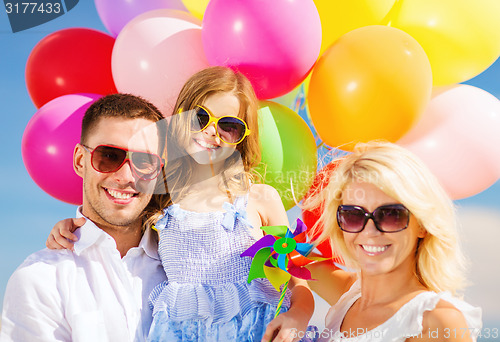 Image of family with colorful balloons