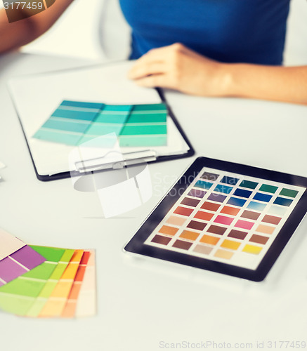 Image of woman working with color samples for selection