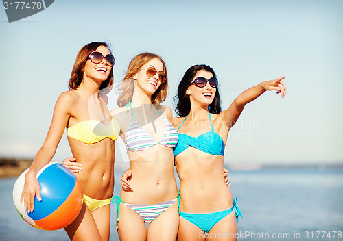 Image of girls with ball on the beach