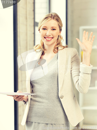 Image of happy woman with documents