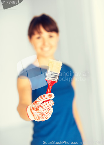 Image of woman with paintbrush