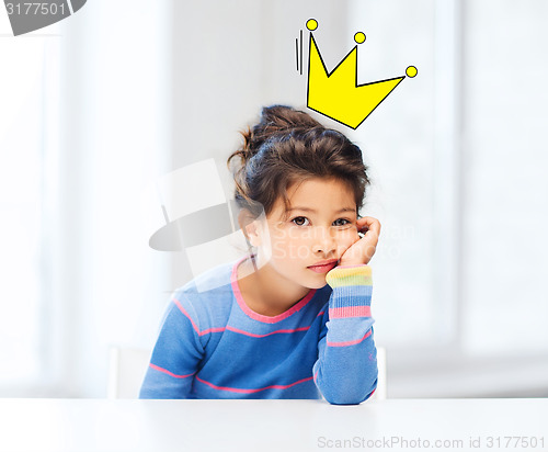 Image of bored little girl with crown doodle over head