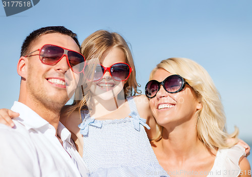 Image of happy family with blue sky