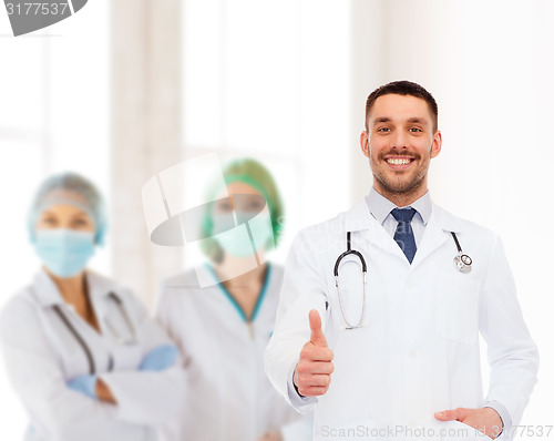 Image of smiling doctor with stethoscope showing thumbs up