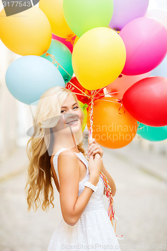 Image of woman with colorful balloons