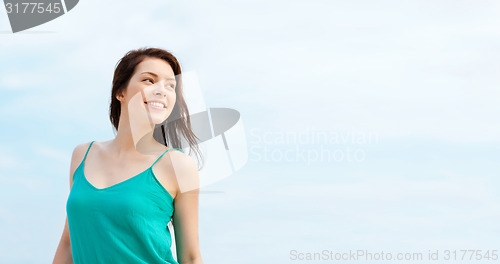 Image of girl standing on the beach