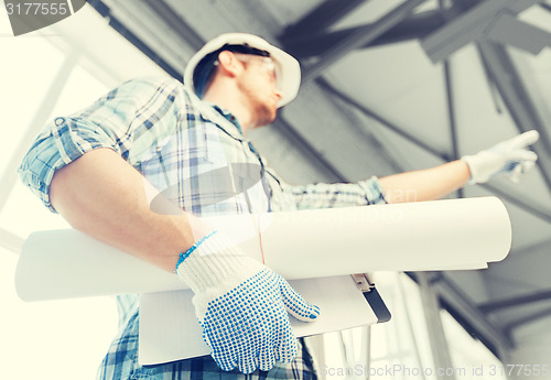 Image of man with blueprint