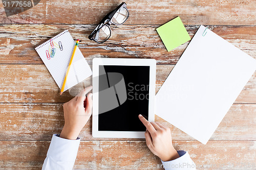 Image of close up of female hands with tablet pc and coffee