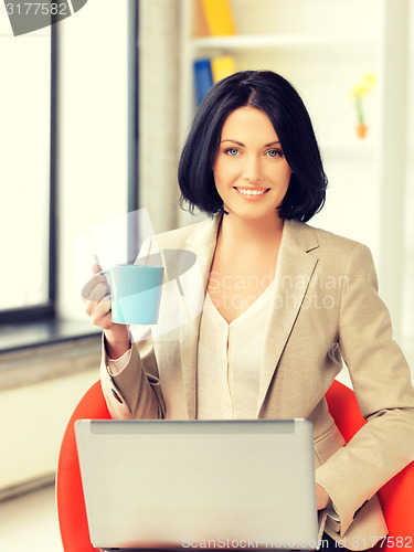 Image of happy woman with laptop computer