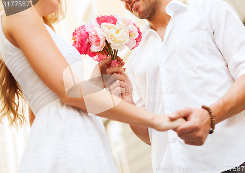 Image of couple with flowers in the city
