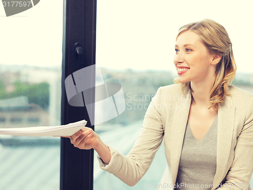 Image of happy woman with documents