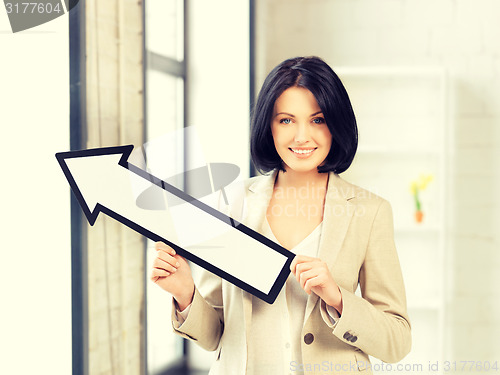 Image of businesswoman with direction arrow sign