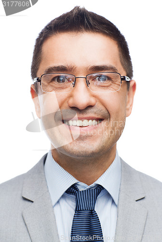 Image of happy smiling businessman in eyeglasses and suit