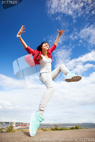 Image of beautiful dancing girl jumping