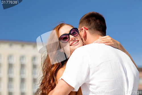 Image of smiling couple in city