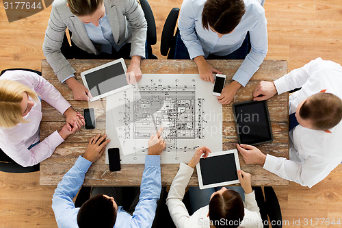Image of business team or architects with blueprint