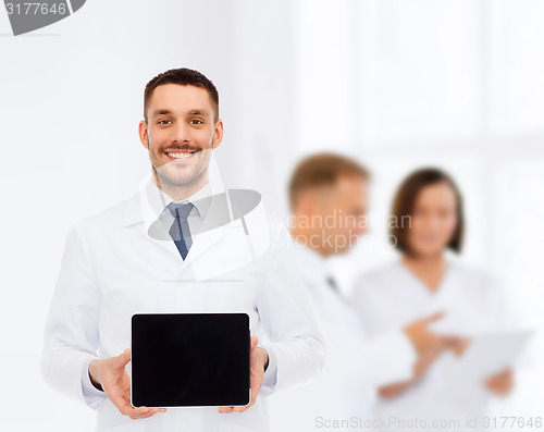 Image of smiling male doctor with tablet pc