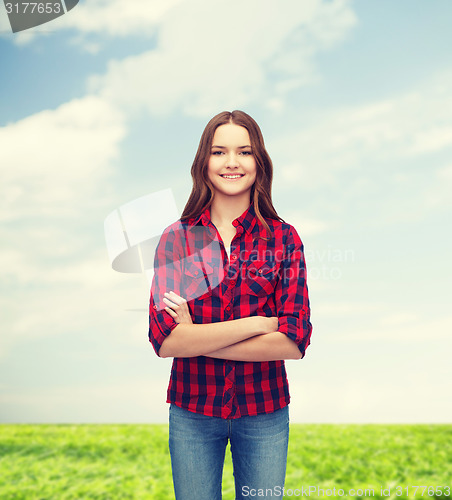 Image of smiling young woman in casual clothes