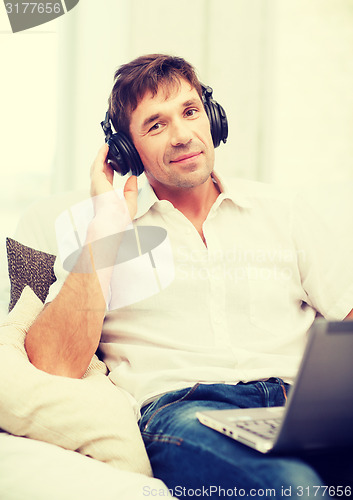 Image of man with headphones listening to music