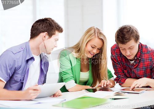 Image of students browsing in tablet pc at school