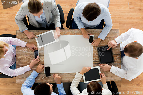 Image of business team with smartphones and tablet pc