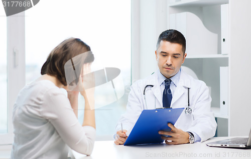 Image of doctor and young woman meeting at hospital