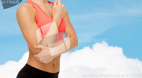 Image of sporty woman with pain in elbow