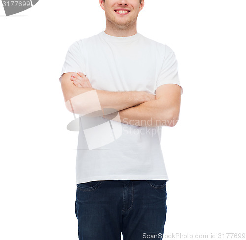 Image of smiling young man in blank white t-shirt