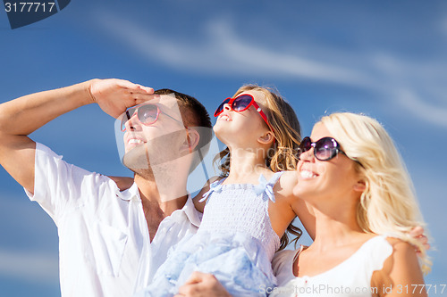 Image of happy family with blue sky