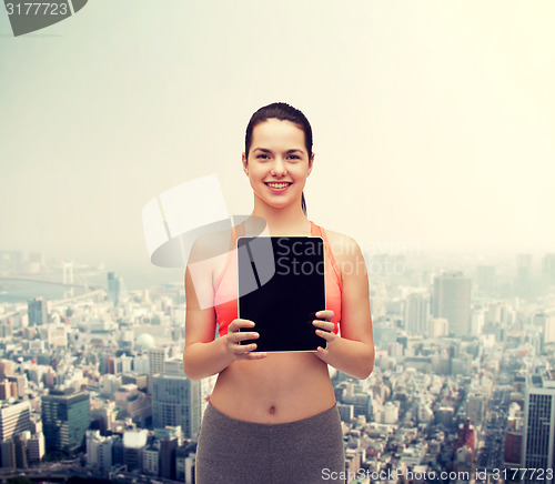 Image of sporty woman with tablet pc blank screen