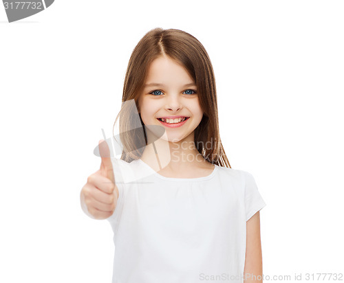 Image of little girl in blank white tshirt showing thumbsup