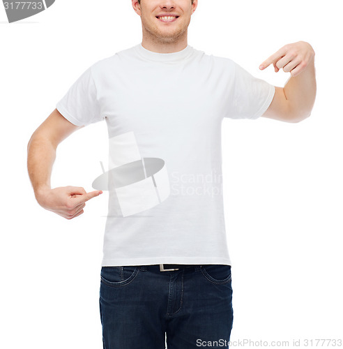 Image of smiling young man in blank white t-shirt