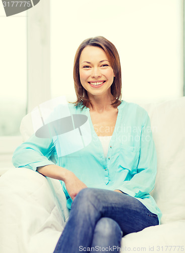 Image of smiling woman at home