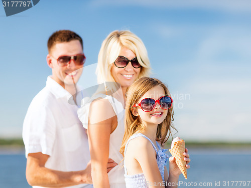 Image of happy family eating ice cream