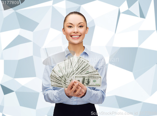 Image of young businesswoman with dollar cash money