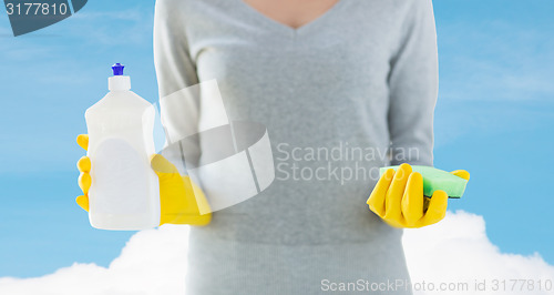 Image of close up of woman with sponge and cleanser