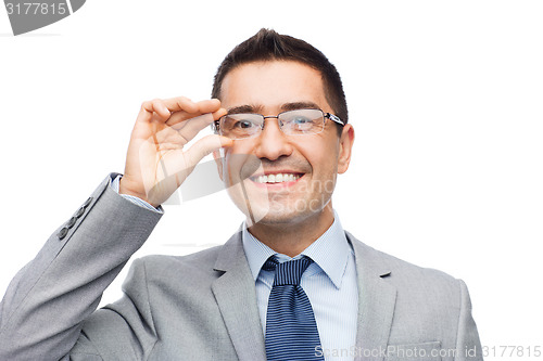 Image of happy smiling businessman in eyeglasses and suit