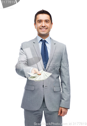 Image of smiling businessman with american dollar money