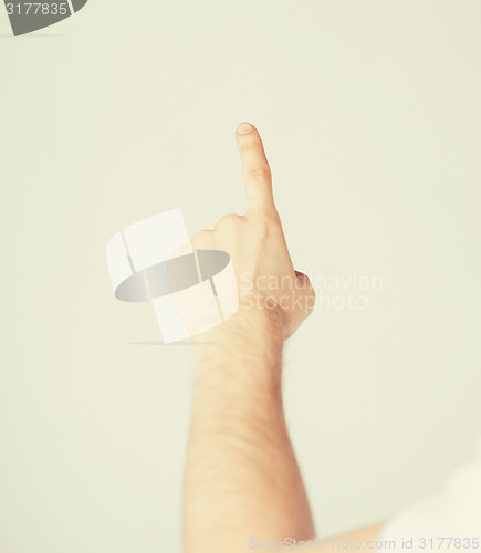 Image of man hand pointing at something