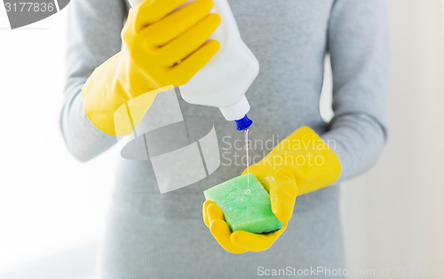 Image of close up of woman with sponge and cleanser