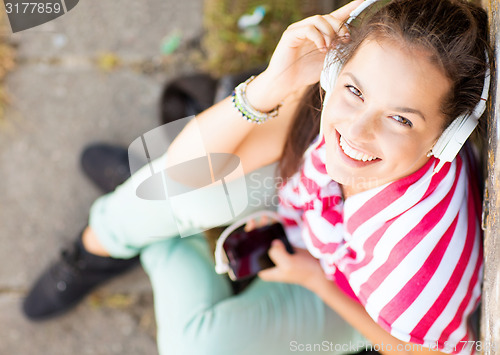 Image of girl with headphones listening to music