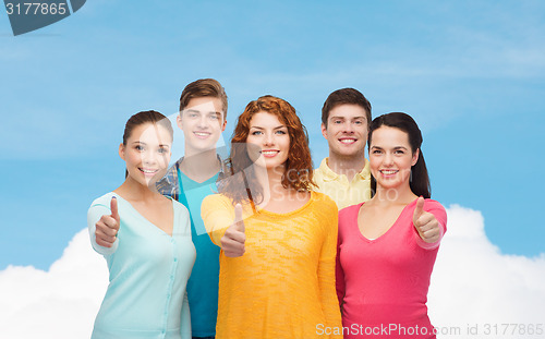 Image of group of smiling teenagers showing thumbs up