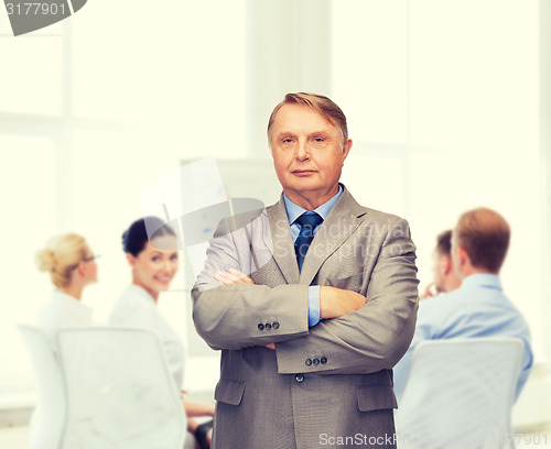 Image of serious businessman or teacher in suit