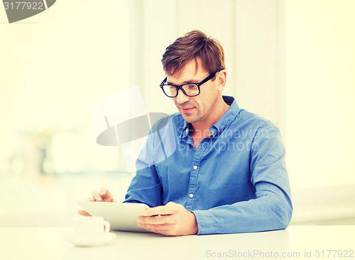 Image of man working with tablet pc at home