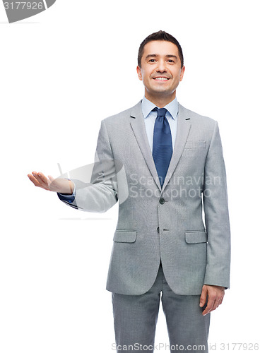 Image of happy smiling businessman in suit