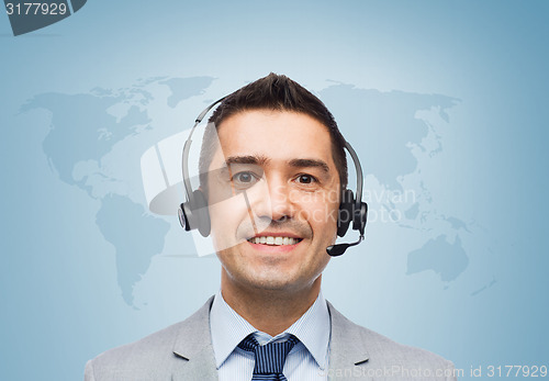 Image of smiling businessman in headset